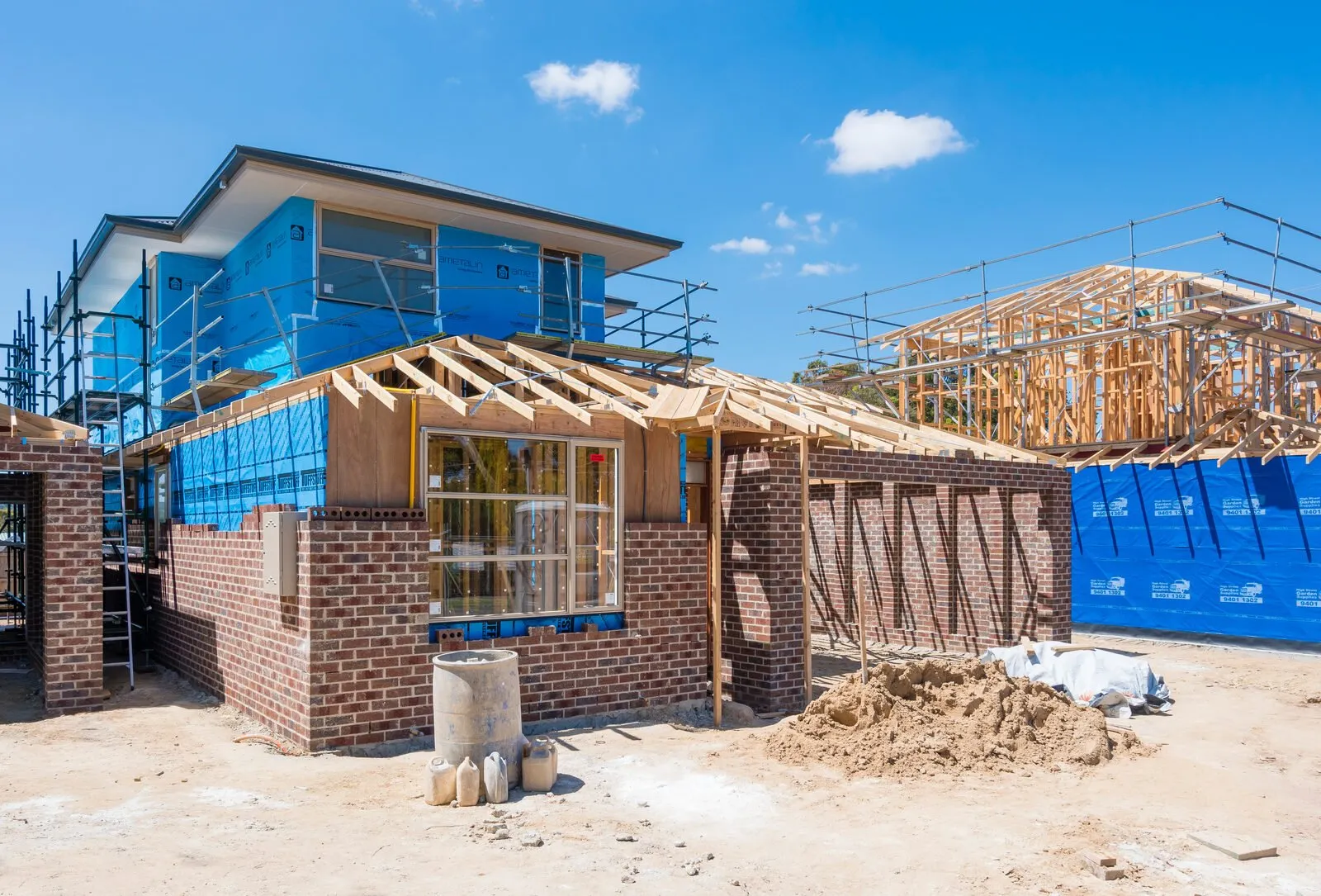 New timber wall and roof framing for a second storey addition being tied into an existing Queensland home